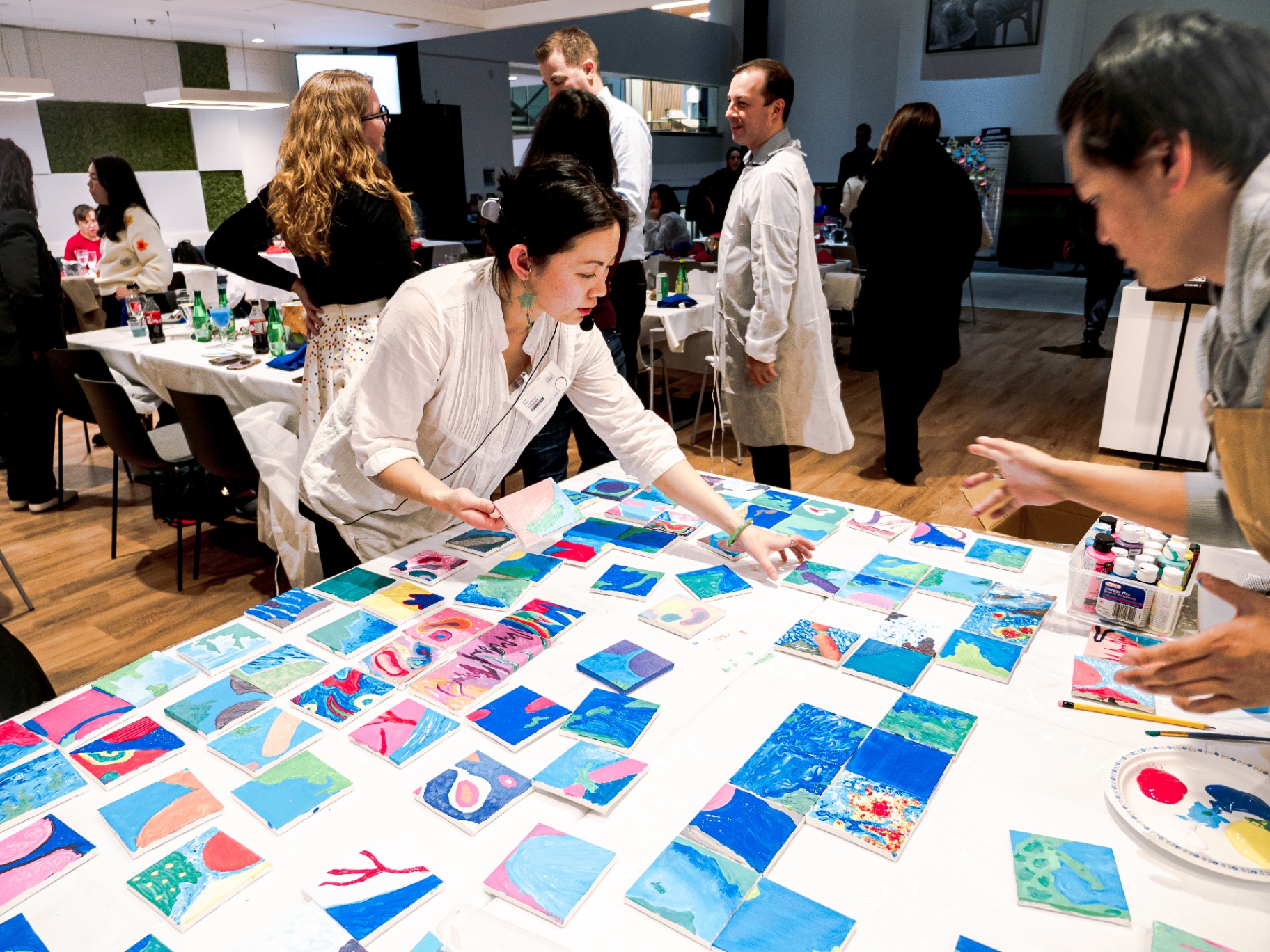 Mosaic of tiny paintings made by a corporate team